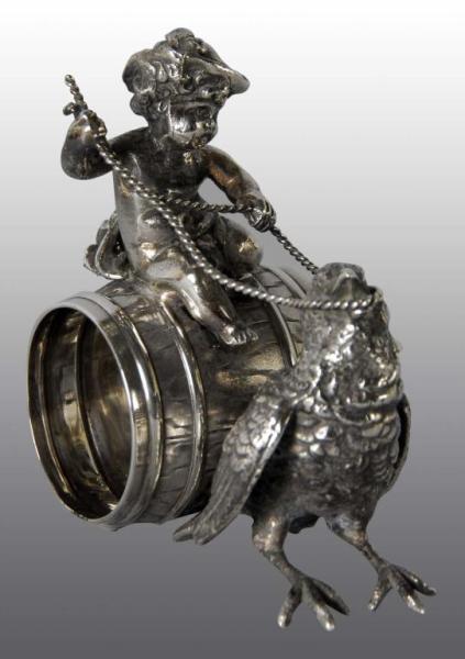 Appraisal: Girl on Barrel Figural Napkin Ring Description Also features bird