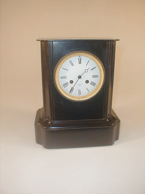 Appraisal: A thC French black slate mantle clock an eight day