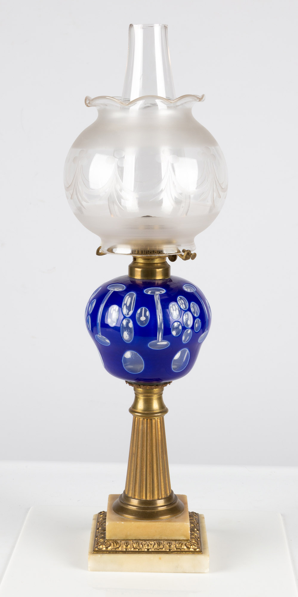 Appraisal: BOSTON AND SANDWICH GLASS COMPANY BLUE OVERLAY OIL LAMP Mid