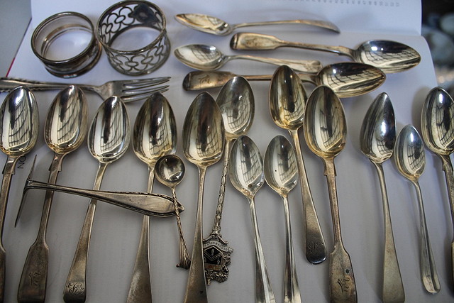 Appraisal: A COLLECTION OF VARIOUS SILVER TEASPOONS a crumb pusher napkin