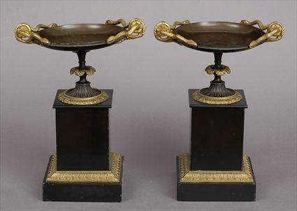 Appraisal: PAIR OF EMPIRE-STYLE GILT-METAL-MOUNTED BLACK MARBLE TAZZE Each shallow bowl