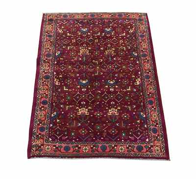 Appraisal: A Malayer Rug Busy geometric foliate design on wine color