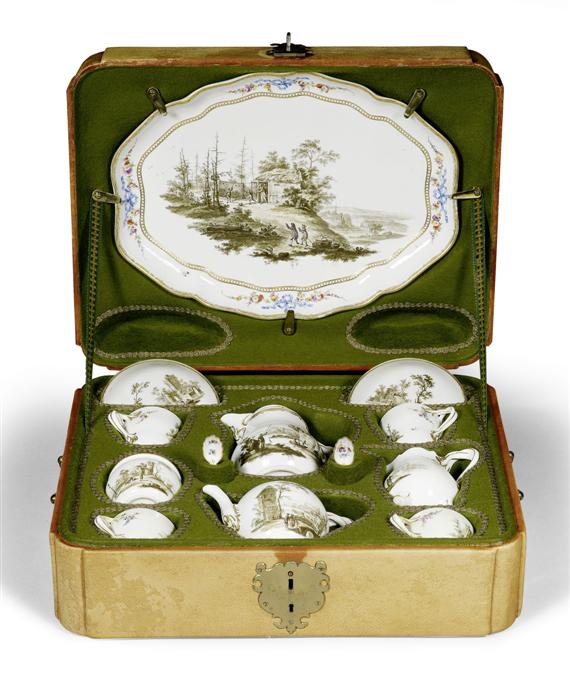 Appraisal: TRAVELING SERVICE WITH LANDSCAPE PAINTING MEISSEN CIRCA In green-lined leather