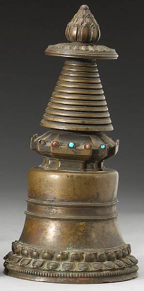 Appraisal: A Tibetan bronze chorten The bell-form stupa model encircled by