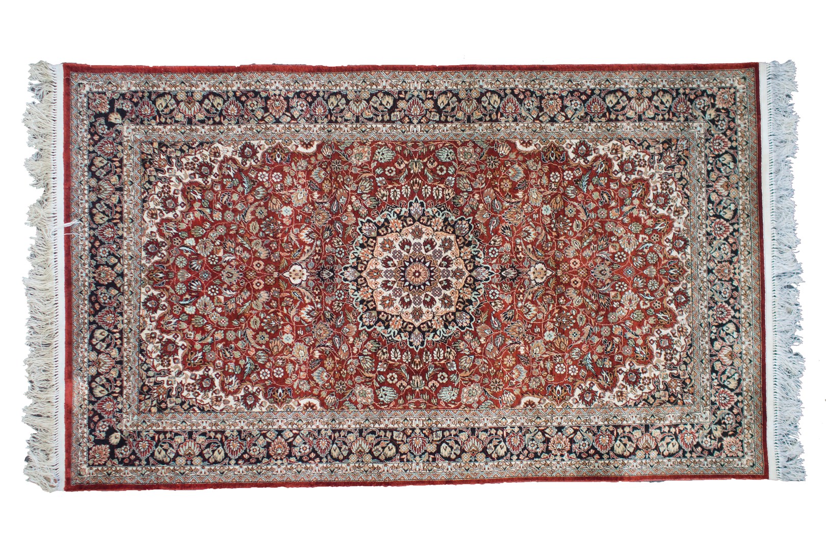 Appraisal: A fine Hereke silk rug Turkish the madder field with