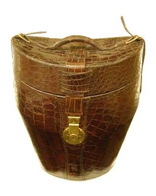 Appraisal: A crocodile hat box with brass buckles and lock stamped