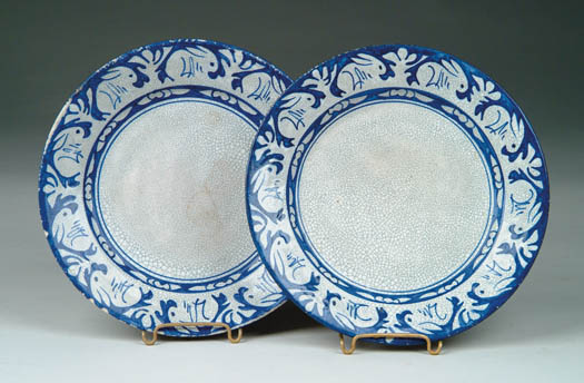 Appraisal: PAIR OF DEDHAM POTTERY PLATES WITH RABBIT DECORATION Blue marks