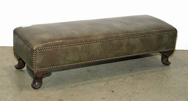 Appraisal: A Regency style leather upholstered walnut stool mid th century