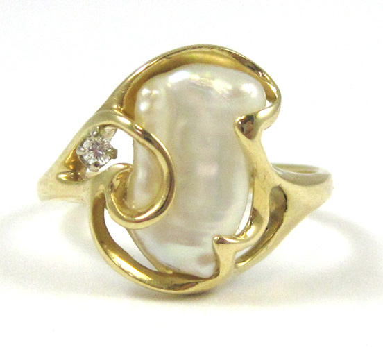 Appraisal: BAROQUE PEARL AND DIAMOND RING k yellow gold set with