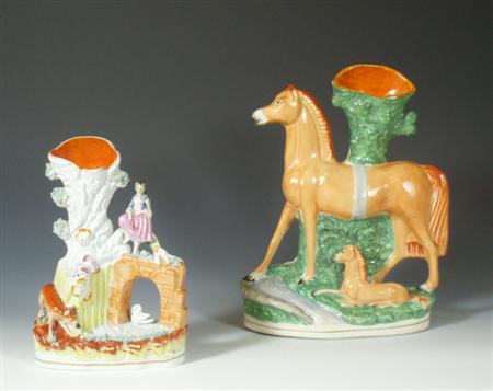 Appraisal: A mid Victorian Staffordshire spill vase of a horse and