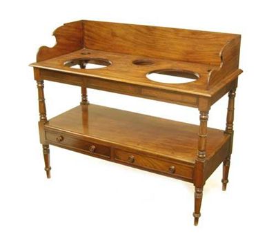 Appraisal: An early Victorian mahogany double washstand in the manner of