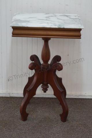 Appraisal: 's Victorian Solid Mahogany Marble Top Table Produced by Victorian