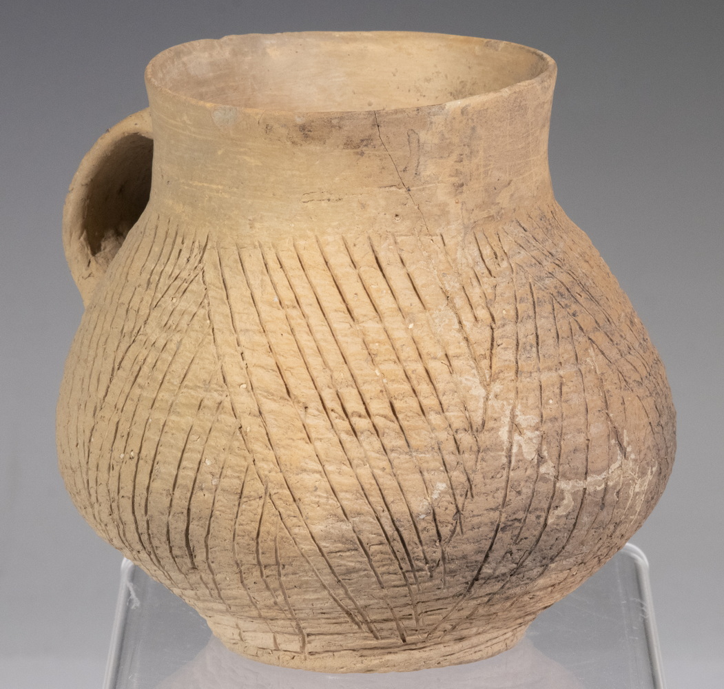 Appraisal: CHINESE NEOLITHIC TERRACOTTA CUP Bulbous Cup with standing rim thin-walled