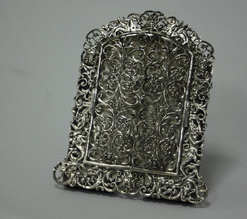 Appraisal: A Victorian silver easel-back photograph frame London of arched form