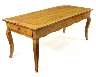 Appraisal: A th century French cherrywood farmhouse table the cleated plank