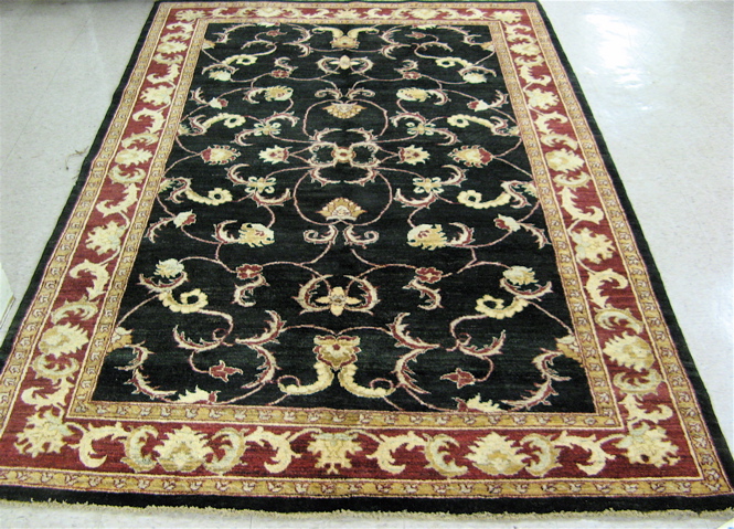 Appraisal: HAND KNOTTED ORIENTAL CARPET Pakistani Persian overall scrolling floral raceme