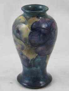 Appraisal: A Moorcroft vase with tube line Pansy decoration signed with