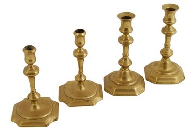 Appraisal: A pair of mid th century brass candlesticks with concave