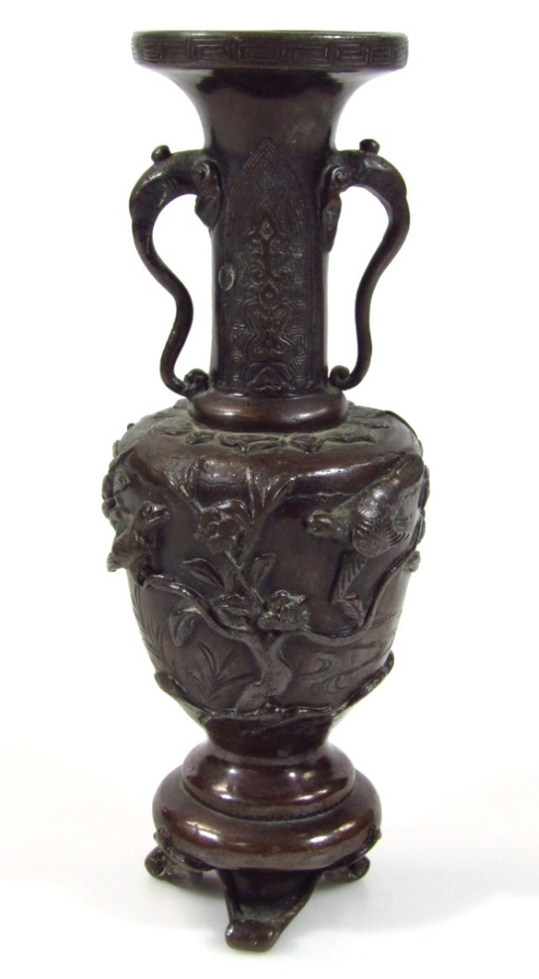 Appraisal: A thC bronze vase the trumpet shaped stem and lid