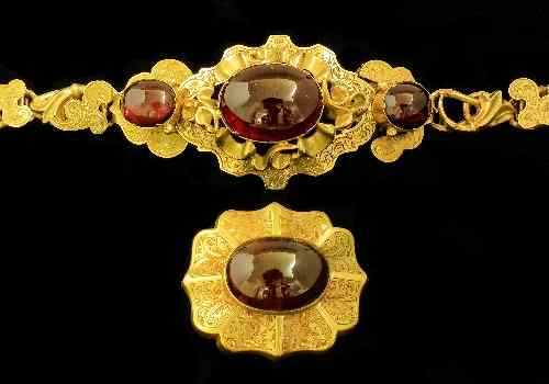 Appraisal: A late Victorian mm gold coloured metal mounted garnet set