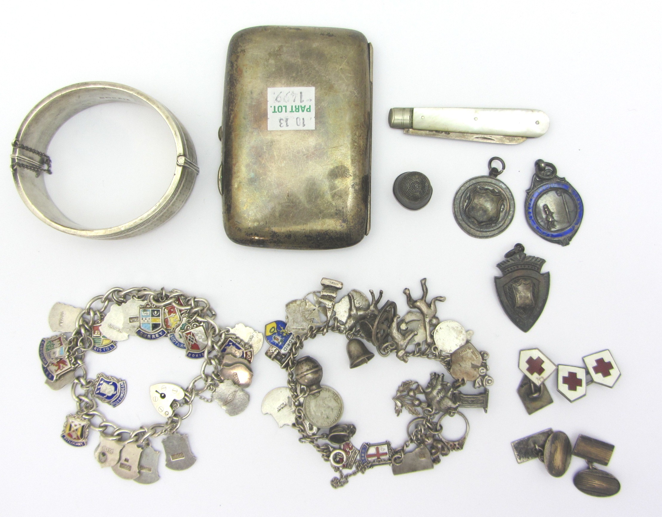 Appraisal: Mostly silver comprising an enameled bracelet with shield shaped charms