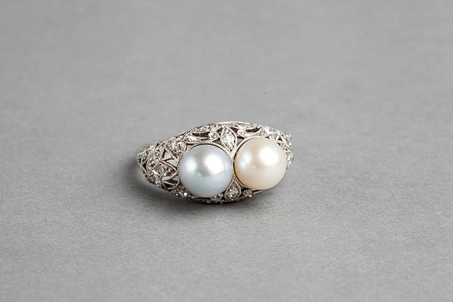 Appraisal: A PEARL AND DIAMOND SET DRESS RING two peg set