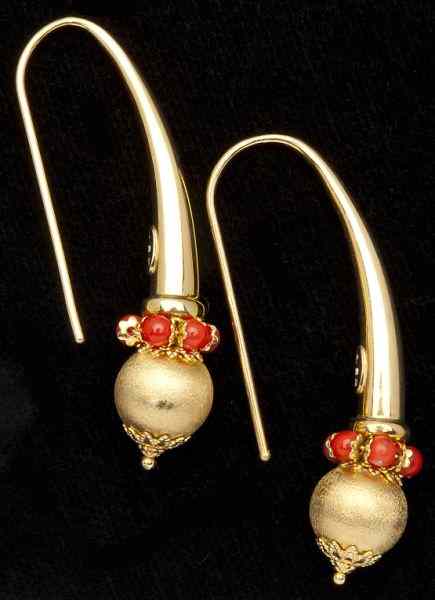 Appraisal: Modernistic Gold and Coral Earringsfashioned in a continuous form terminating