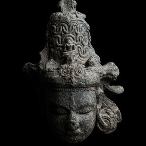 Appraisal: An Indian Carved Black Stone Head of a Vishnu the