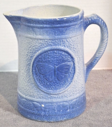 Appraisal: Blue white Salt Glazed Stoneware Pitcher high with a butterfly