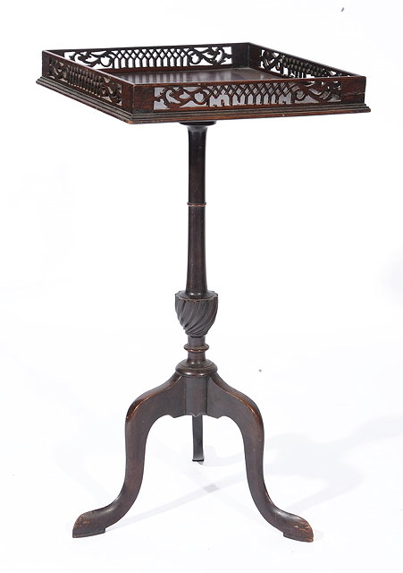 Appraisal: A GEORGIAN STYLE MAHOGANY WINE TABLE with square pierced galleried