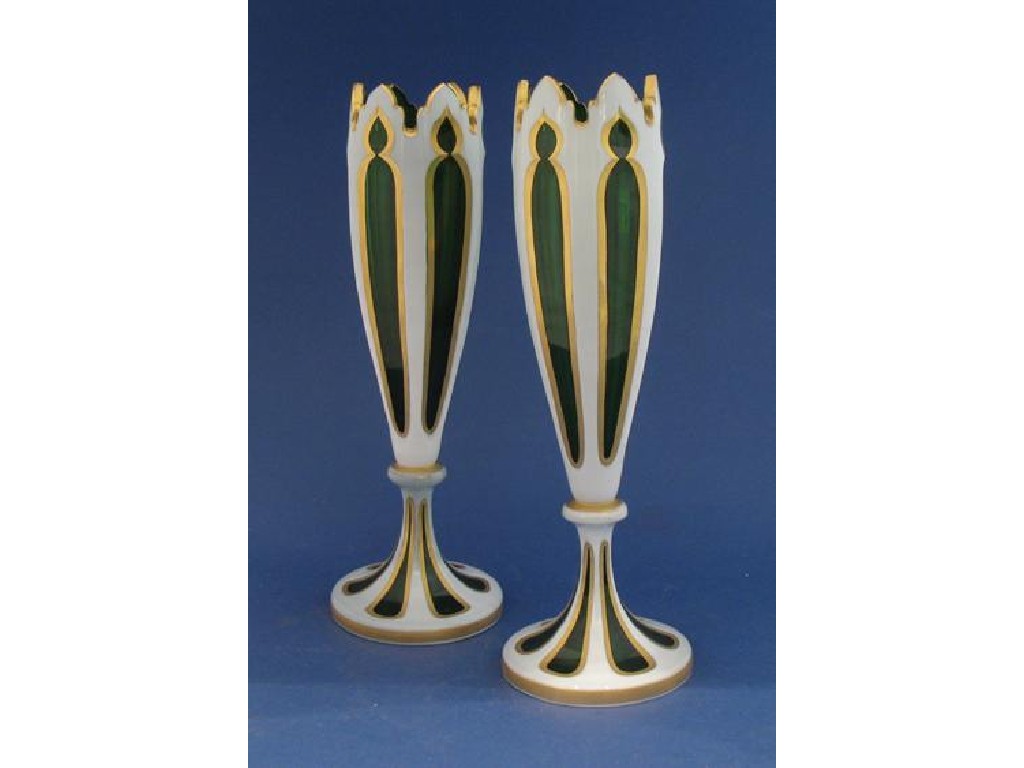 Appraisal: A PAIR OF BOHEMIAN GREEN AND OVERLAID GLASS VASES with