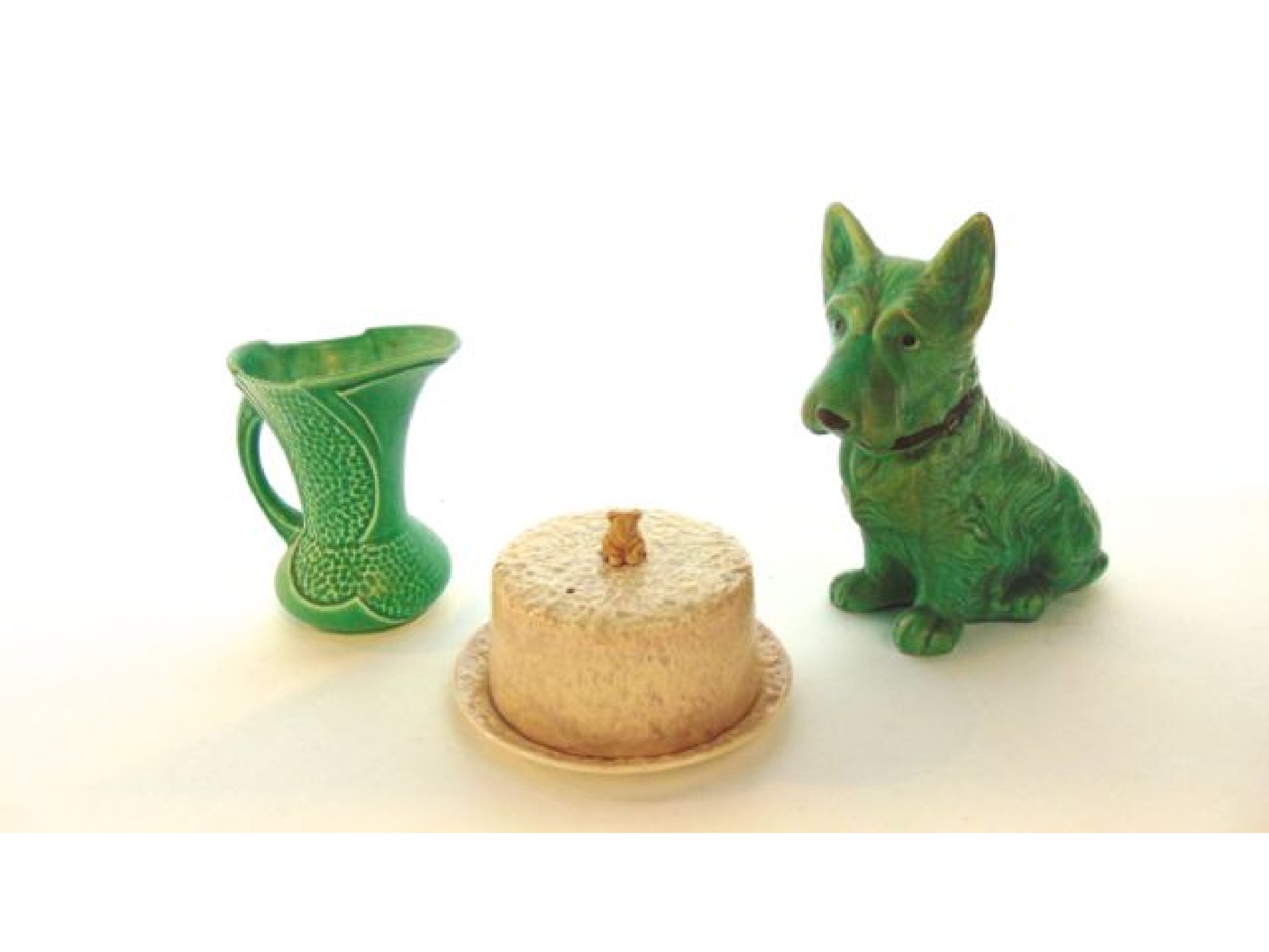 Appraisal: A Sylvac green glazed model of a seated Scottie dog