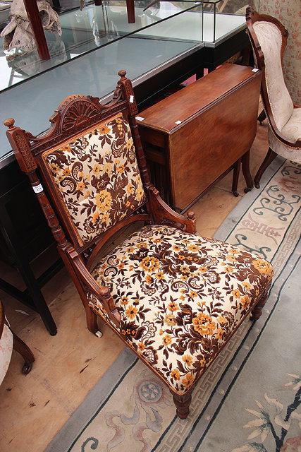 Appraisal: A LATE VICTORIAN UPHOLSTERED LOW CHAIR together with a Victorian