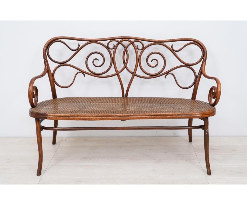 Appraisal: Bentwood settee marked Thonet with scrolled back and kidney-shaped cane