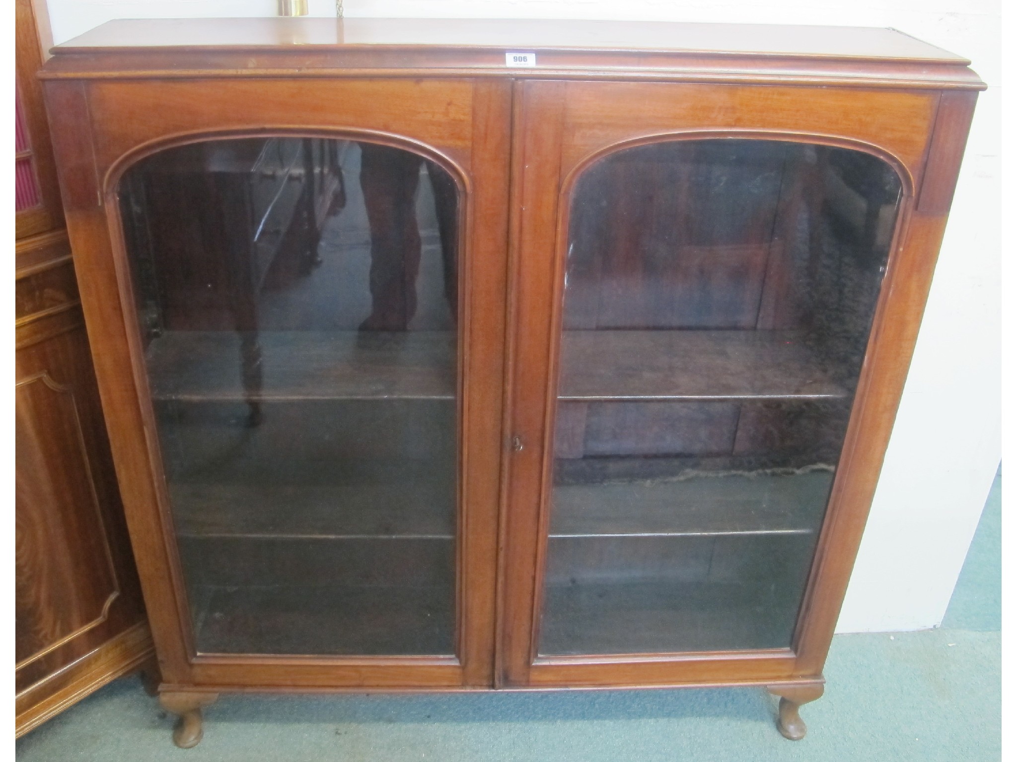 Appraisal: A mahogany two door glazed bookcase top