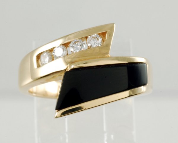 Appraisal: Onyx and diamond ring set in yellow gold marked K