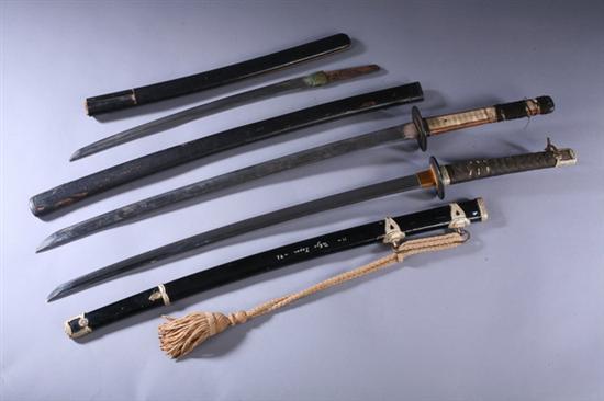 Appraisal: TWO JAPANESE KATANA AND ONE WAKIZASHI One inscribed on scabbard