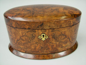 Appraisal: A late Victorian figured walnut twin division tea caddy of