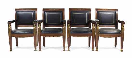 Appraisal: A Set of Four Empire Style Armchairs having square backs