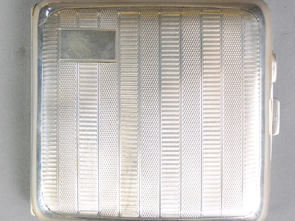 Appraisal: SILVER CURVED OBLONG POCKET CIGARETTE CASE with striped engine turned