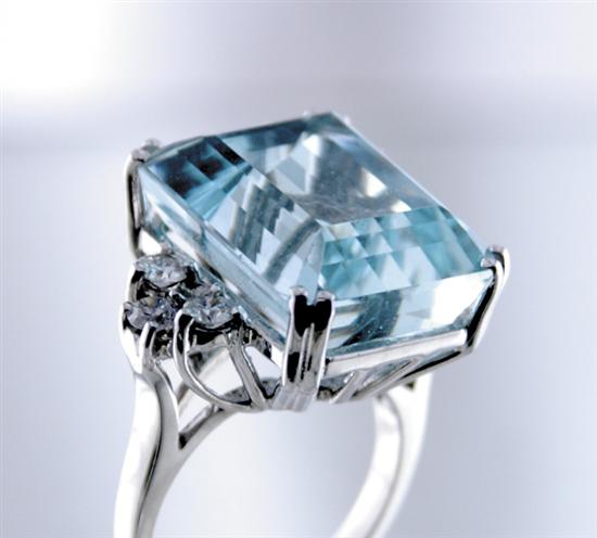 Appraisal: Aquamarine and diamond cocktail ring emerald-cut aquamarine ct flanked by