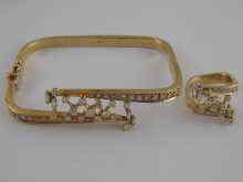 Appraisal: A yellow metal tests carat gold and diamond bangle and