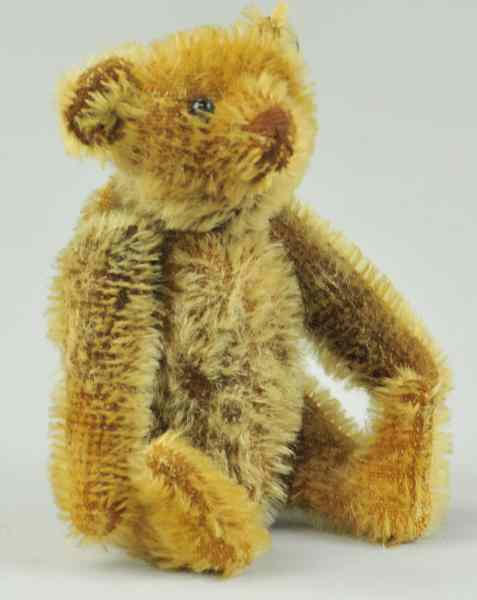 Appraisal: STEIFF RATTLE TEDDY BEAR WITH BIG BUTTON c a beloved