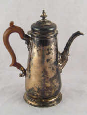 Appraisal: A silver coffee pot in the early Georgian style with