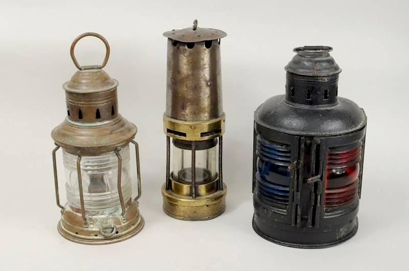 Appraisal: Three Brass Iron Lanterns Three brass and iron lanterns including