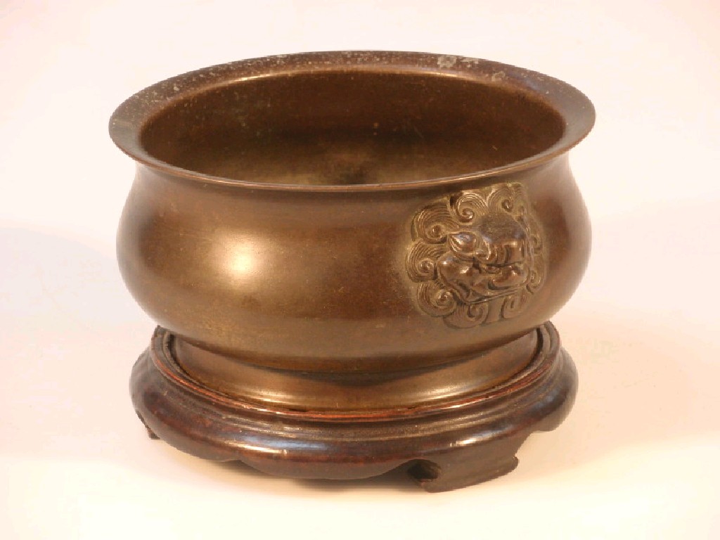 Appraisal: An thC Chinese bronze bomb censer mounted with two Buddistic