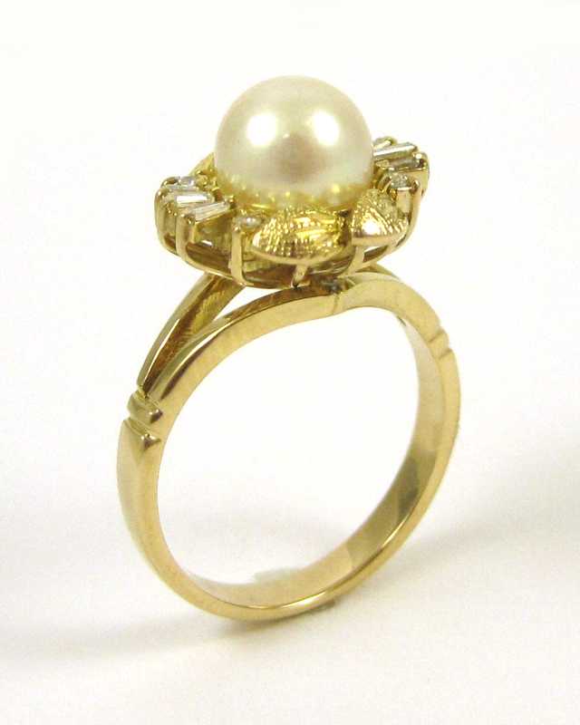 Appraisal: FOURTEEN KARAT GOLD DIAMOND AND PEARL RING the single mm