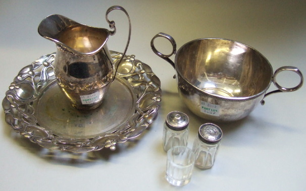 Appraisal: A silver cream jug a silver twin handled sugar bowl