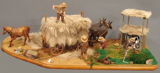 Appraisal: John Dale carving with workers and animals clearing hay Artist