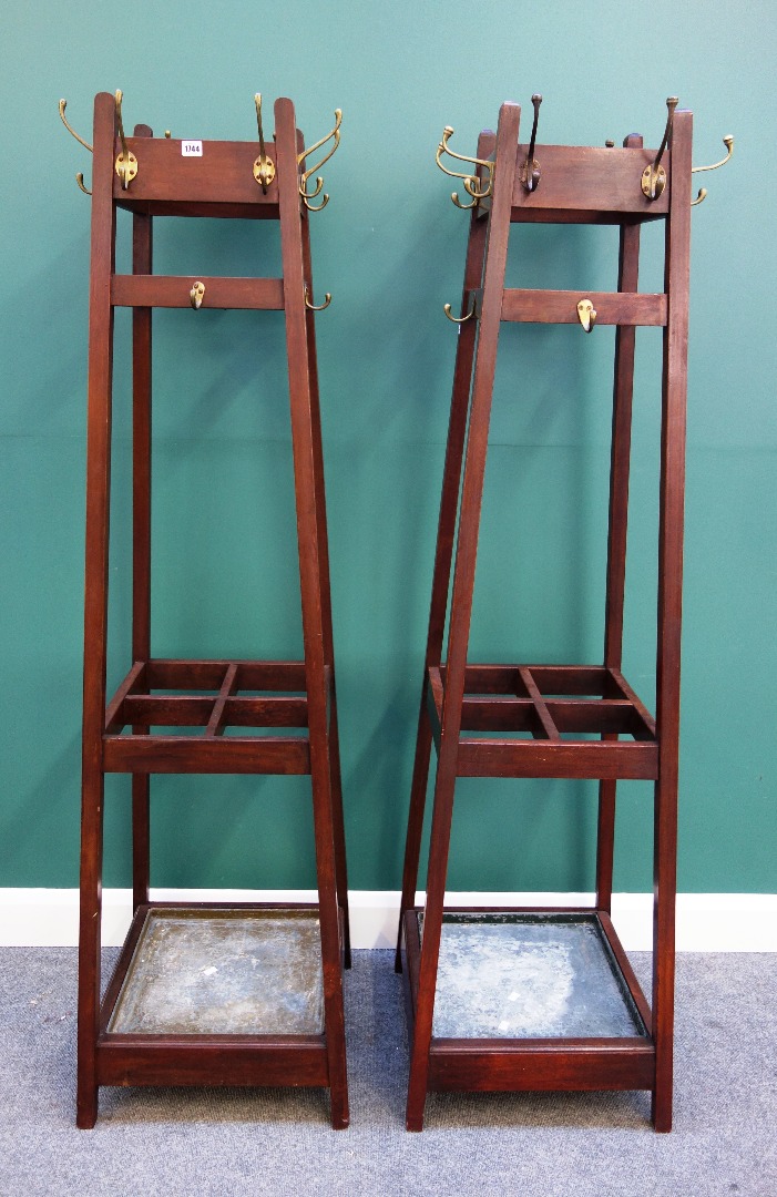 Appraisal: A pair of mid- th century mahogany coat umbrella stands